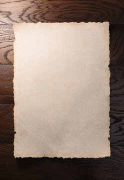  Old aged paper or scroll on wooden table