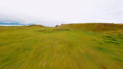 FPV Aerial View of Historical landmark based in north wales known as Twr Mawr Lighthouse. Birds eye fast pace flying, North Wales uk