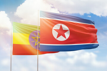 Sunny blue sky and flags of north korea and ethiopia