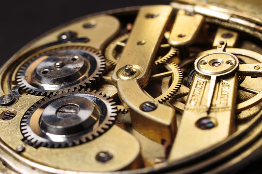Old mechanical pocket watch. Clockwork gears wheels, close-up view.