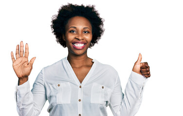 African american woman with afro hair wearing casual white t shirt showing and pointing up with fingers number six while smiling confident and happy.