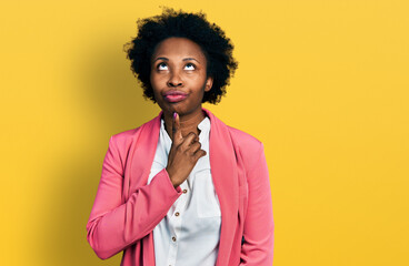 African american woman with afro hair wearing business jacket thinking concentrated about doubt...