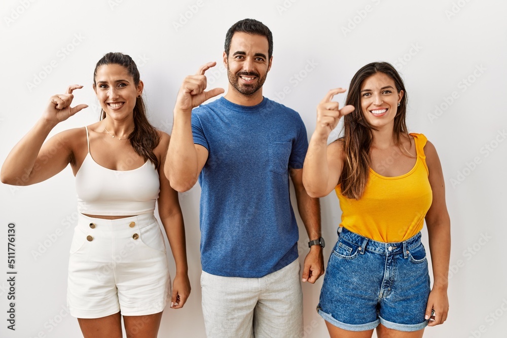 Poster group of young hispanic people standing over isolated background smiling and confident gesturing wit