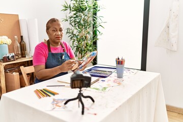 Senior african american woman recording draw tutorial at art studio