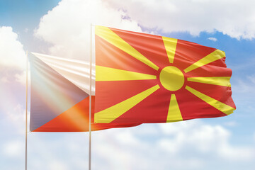 Sunny blue sky and flags of north macedonia and czechia