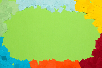 green copy space around it colorful chopped paper, creative art background