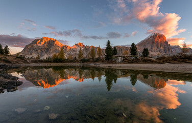 Autumn scenery by the lake Limides in Dolomites mountains.