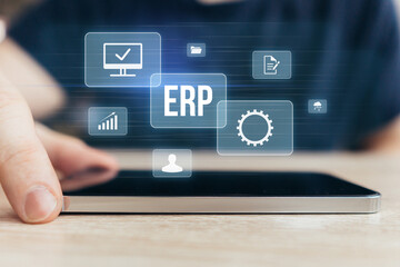 Concept ERP or Enterprise Resource Planning. Business acronym. Holographic display with icons over smartphone.