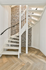 White minimalistic modern spiral staircase and parquet floor