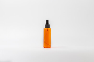 Orange empty spray bottle, can be labeled, with white background, isolated, plastic, oil spray bottle