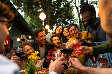 Group of people toasting with wine and beer - Happy friends having fun outdoor – hand toasting...