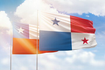Sunny blue sky and flags of panama and chile