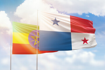 Sunny blue sky and flags of panama and ethiopia