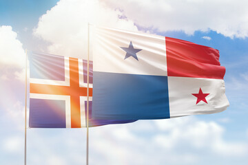 Sunny blue sky and flags of panama and iceland