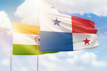 Sunny blue sky and flags of panama and india