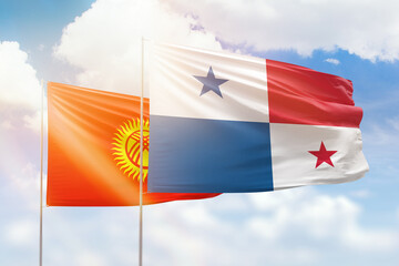 Sunny blue sky and flags of panama and kyrgyzstan