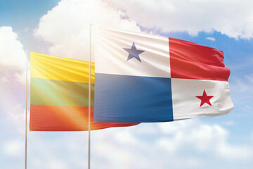 Sunny blue sky and flags of panama and lithuania