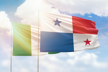 Sunny blue sky and flags of panama and nigeria