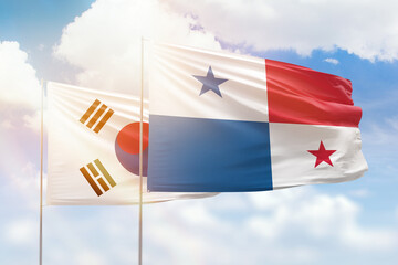 Fototapeta na wymiar Sunny blue sky and flags of panama and south korea
