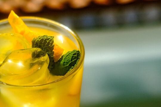 Ice cold fresh maraquia orange lemonade with mint and orange slices in a glass