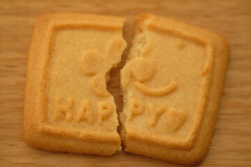 broken biscuit that reads HAPPY