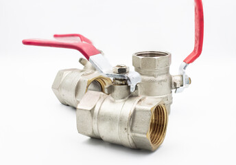 Stainless ball valve two way. Water valve isolated on white background. Valve with red handle.