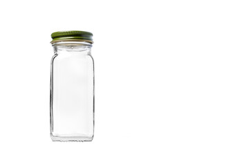 Empty Square Glass jar for seasoning with Green Cap isolated on white background with room for copy