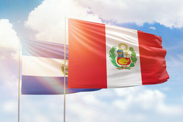 Sunny blue sky and flags of peru and el salvador