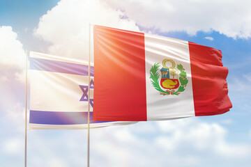 Sunny blue sky and flags of peru and israel