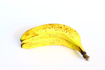 ripe banana fruit with dark spots in white background,selective focus