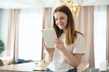 A freelance video student uses a laptop computer at home online training, distance learning on the school website