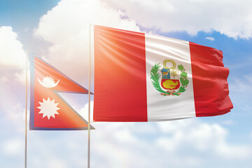 Sunny blue sky and flags of peru and nepal