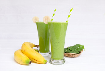Banana mix spinach  fresh cocktail vanilla smoothies  fruit juice beverage healthy the taste yummy in glass drink episode good morning on wooden background.