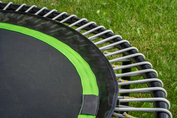 detail of mini trampoline for fitness exercising and rebounding in a backyard