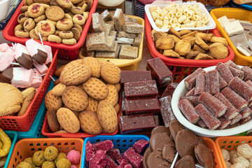 Traditional sweets: cookies, jelly, candy, chocolate, marshmallow, candied fruits, nuts and more at open market during catholic Corpus Christi celebration in Ecuador, Cuenca