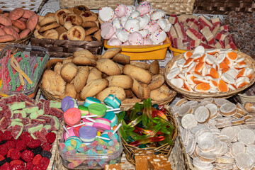 Traditional sweets: cookies, jelly, candy, chocolate, marshmallow, candied fruits, nuts and more at open market during catholic Corpus Christi celebration in Ecuador, Cuenca