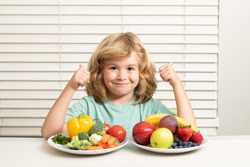 Fruits and vegetables. Funny kid boy having breakfast. Milk, vegetables and fruits healthy food nutrition for children.
