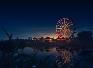 Old carnival with a ferris wheel on a cloudy night. 3D rendering, illustration - 511803547