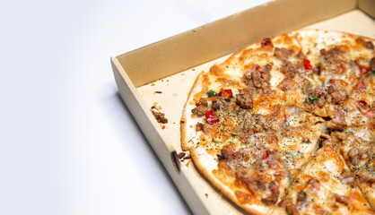 hot chilli pork pizza inside paper box on white inside