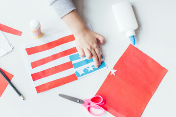 Step-by-step instruction. Child makes a postcard to the 4th of July. Patriotic holiday. Process kid children craft.USA Independence Day. Diy 4th of July decor color American flag. Flat lay top view