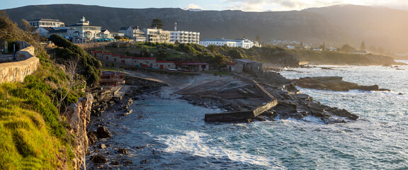 Beautiful sunrise panorama of the fishing port of the South African city of Hermanus, which is one of the southernmost cities in Africa and one of the best cities in the world for whale watching.