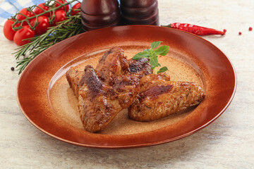 Roasted chicken wings with spicy sauce