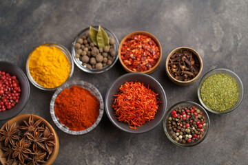 Herbs and spices in metal bowls. Food and cuisine ingredients. Colorful natural additives.