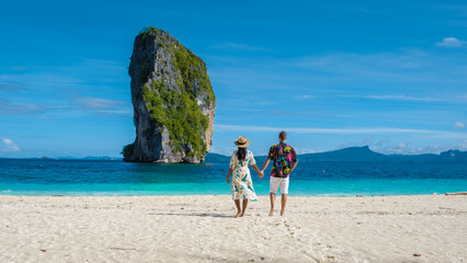 Koh Poda Krabi Thailand, Asian woman and European men walking on the tropical beach of Koh Poda...
