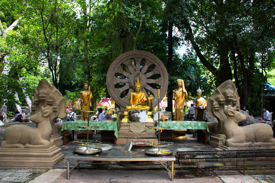Ancient buddha statue for thai people traveler travel visit and respect praying and blessing wish holy mystery in meditate garden park at Wat Sangkhatan temple on June 7, 2022 in Nonthaburi, Thailand