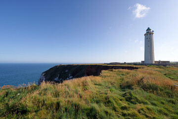 Fototapeta na wymiar Cliffs and Antifer lighthouse in the Normandy coast