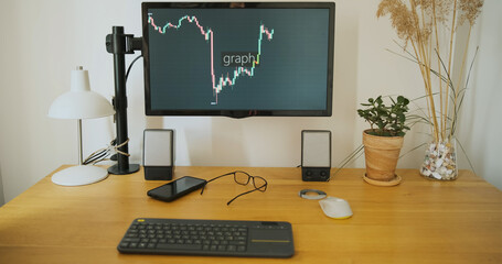 Monitor screen at the workplace with a graph of the growth and fall of cryptocurrency or securities. Profit loss, trading from home. Online income.