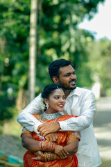 Beautiful happy south Indian couple in traditional dress   Outdoor 