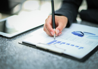 Business lady taking business notes at office