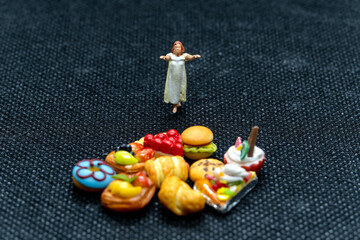 Miniature people Female sleepwalker in pajama dream about snack at night , Unhealthy concept